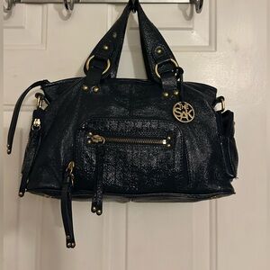 The Sak Shiny Navy Blue Coated Leather Bag with Gold Accents